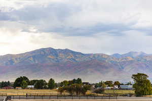 Property view of mountains with a rural view