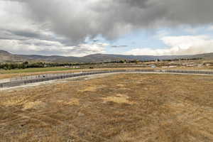 Property view of mountains with a rural view