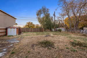 View of yard featuring a storage unit