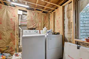 Laundry area with washer and clothes dryer