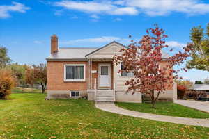 View of front of property with a front lawn