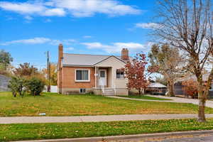 Bungalow with a front lawn