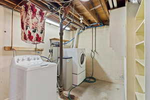 Laundry area with washing machine and gas dryer