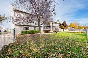 View of yard featuring a wooden deck