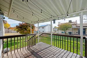 Wooden deck featuring a lawn