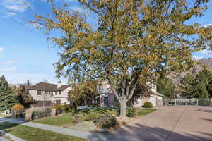 View of side of home with garage and additional parking