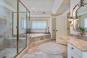 Owners suite, separate jetted tub and shower