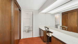 Bathroom featuring tile patterned flooring, vanity, a textured ceiling, and toilet