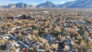 Drone / aerial view featuring a pond and community view