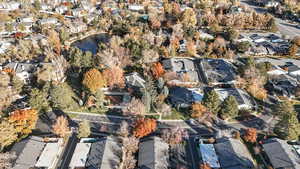 Birds eye view of property with a water view