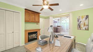 Office featuring light carpet, ceiling fan, and crown molding - Virtual staging