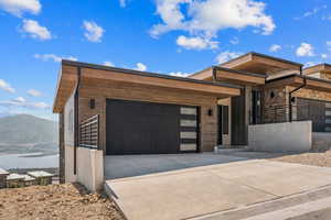 Contemporary house with a mountain view and a garage