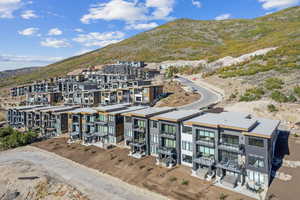 Birds eye view of property with a mountain view