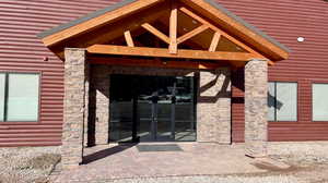 View of exterior entry featuring french doors