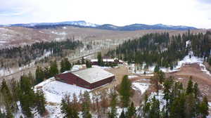 Snowy aerial view featuring a mountain view