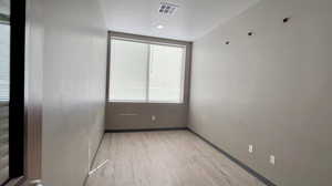 Spare room with light wood-type flooring