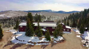 Snowy aerial view with a mountain view