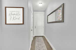 Entryway with hardwood and double door storage/coat closet