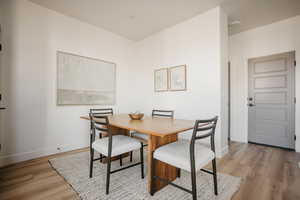 Dining area with light hardwood / wood-style floors