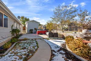 View of yard featuring a patio and a hot tub