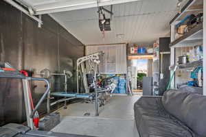 Workout room featuring concrete flooring