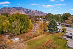 Aerial view of back yard with a mountain view