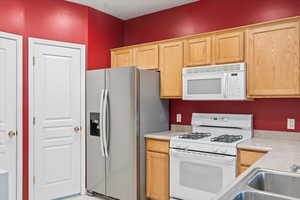 Kitchen featuring gas stove, large pantry, and included appliances.