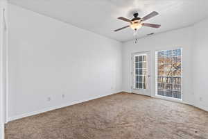 Primary bedroom with private balcony access