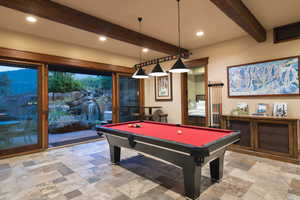 Playroom featuring beam ceiling, french doors, and pool table