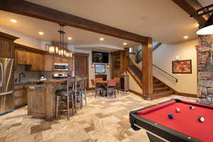 Game room featuring beam ceiling, sink, and pool table