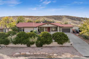 Ranch-style house with a mountain view and a garage