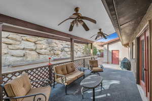 View of patio featuring ceiling fan