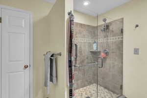 Bathroom with a shower with door