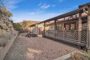 View of side of home with a mountain view