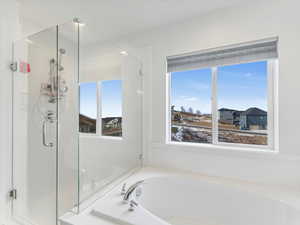 Bathroom featuring plus walk in shower