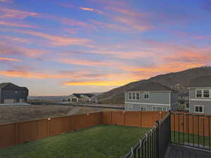 Yard at dusk with a mountain view