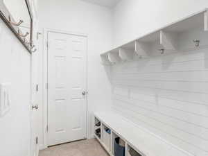 Mudroom featuring light tile patterned floors