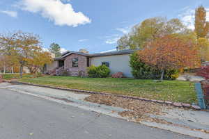 View of front of house with a front yard