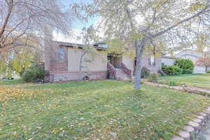 View of front of property featuring a front lawn