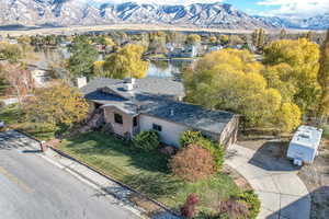 Aerial view featuring a water and mountain view