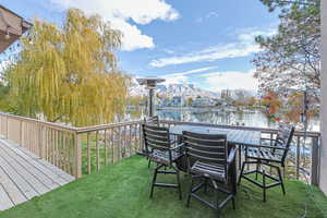 View of yard featuring a deck with water view