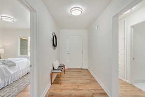 Hall featuring light wood-type flooring