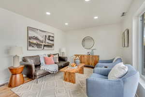 Living room with light wood-type flooring