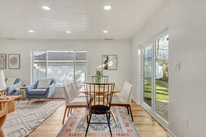 Dining area with light hardwood / wood-style floors