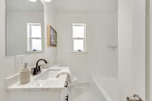 Bathroom with vanity and toilet