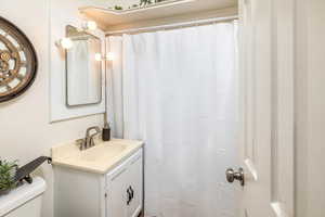 Bathroom with vanity and toilet