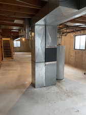 Basement with gas water heater and heating unit