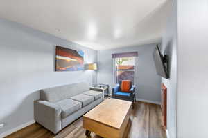 Living room with wood-type flooring