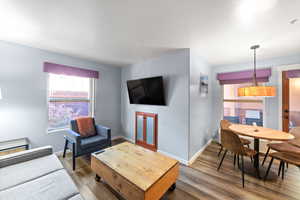 Living room with hardwood / wood-style floors