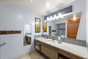 Bathroom featuring vanity and tile patterned floors